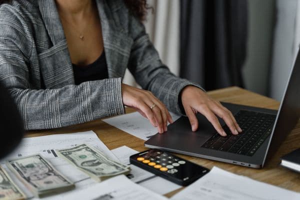 An infographic detailing a 5-step process for easily creating your personal budget in English. Step 1 could depict a person, possibly Hispanic male, brainstorming ideas with a paper and pen, step 2 a South Asian female using a calculator for calculations, step 3 could feature a Middle-Eastern male sorting out bills and receipts, step 4 a Black female planning savings visually on a chart and lastly, step 5 could show a Caucasian male reviewing the final budget on a computer screen.